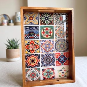 May include: A set of three ceramic mugs with a speckled, matte finish. The mugs are in cream, light grey, and dark grey. Each mug has a simple, minimalist design, ideal for coffee or tea.