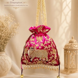 May include: A fuchsia drawstring pouch bag featuring gold metallic embroidery of a cow and floral motifs. The bag has a pearl bead handle and a bottom fringe of small hanging pearls and gold beads. Text reads B.R. fashions Treasures.