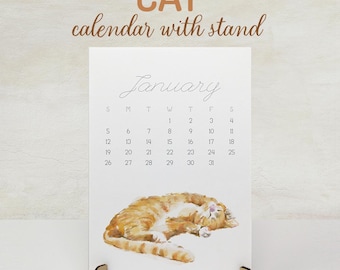 Calendario da scrivania 2027 con gatto e supporto - Agenda mensile mini da ufficio, arte moderna ad acquerello, regalo di Natale, gatto soriano arancione con cavalletto