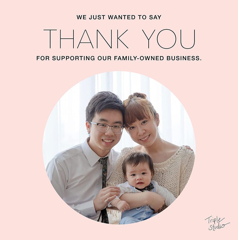 May include: A family of three, a man, a woman, and a baby, are smiling at the camera. The family is standing in front of a window. The text "WE JUST WANTED TO SAY THANK YOU FOR SUPPORTING OUR FAMILY-OWNED BUSINESS." is at the top of the image. The text "Triple Studio" is at the bottom of the image.