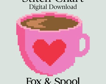 May include: A digital download graphic featuring a pixelated pink coffee cup with a red heart design. The cup is filled with brown liquid and has the text "Stitch Chart Digital Download" and "Fox & Spool STUDIO".