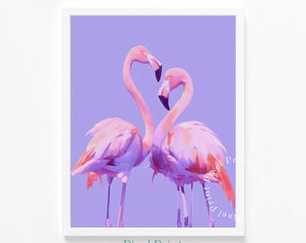 May include: A framed print featuring two pink flamingos with curved necks forming a heart shape against a lavender background. The birds have black beaks and are positioned close together. The print is in a white frame.