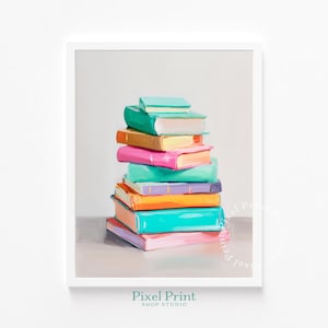 Op de afbeelding: Een ingelijste print met een stapel kleurrijke boeken. De boeken zijn geschilderd in tinten van teal, groen, roze, oranje en paars. Het kunstwerk staat tegen een neutrale achtergrond, met de tekst "Pixel Print Shop Studio" onderaan.