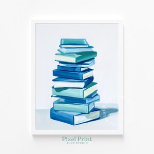 May include: A framed print featuring a stack of books in shades of blue and teal. The books are painted with visible brushstrokes, creating a textured appearance. The artwork is set against a white background, with the text "Pixel Print Shop Studio" at the bottom.