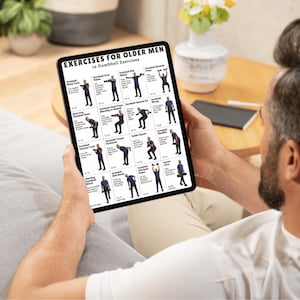 May include: A person holding a tablet displaying "EXERCISES FOR OLDER MEN" with 16 dumbbell exercises. The screen shows illustrated workout routines, including bicep curls, shoulder press, and squats. The tablet is held in a relaxed setting.