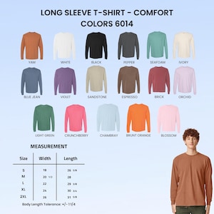 May include: A color chart for long sleeve t-shirts labeled Comfort Colors 6014, displaying seventeen solid color options including yam, white, black, pepper, seafoam, ivory, blue jean, violet, sandstone, espresso, brick, orchid, light green, crunchberry, chambray, brunt orange, and blossom, with a size measurement chart in inches.