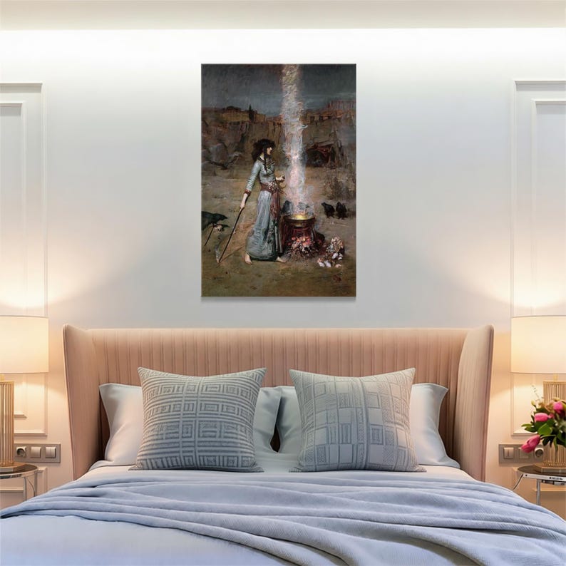 May include: A framed canvas print of a painting depicting a woman in a long dress standing near a cauldron. A beam of light shines down from above. The artwork has a muted color palette with a focus on the central figures and objects.