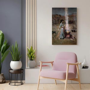 May include: A framed print of a painting depicting a woman in a long blue dress standing near a cauldron with a bright light emanating from it. The artwork has a vintage aesthetic, with a desert landscape background.