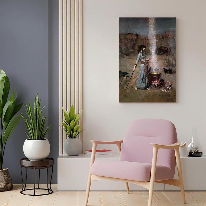 May include: A framed print of a painting depicting a woman in a long blue dress standing near a cauldron with a bright light emanating from it. The artwork has a vintage aesthetic, with a desert landscape background.