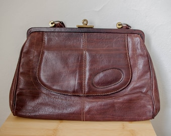 Vintage 1960s chocolate brown handbag with strap and goldtone art deco detailing