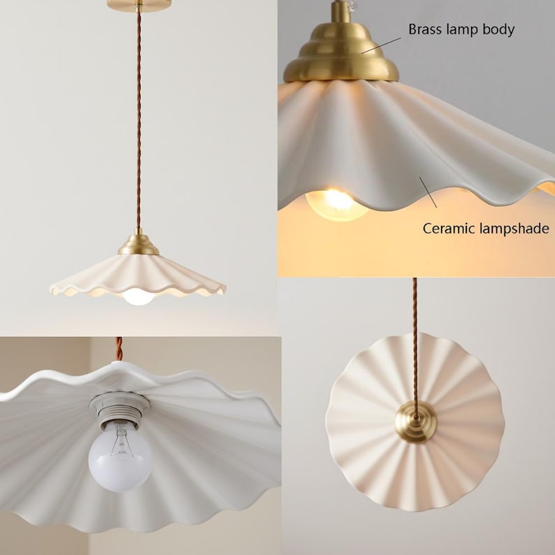 May include: A cream-colored ceramic pendant light with a scalloped lampshade and brass accents. The light fixture has a brown cord and a brass lamp body. The design is a vintage style.