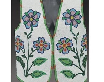 May include: White beaded vest with floral design. The vest features a white base with colorful beaded flowers in blue, pink, orange, and green. The edges are trimmed with green and orange accents. The vest is a sleeveless garment.