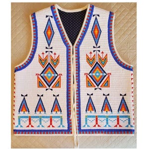 May include: White beaded vest with intricate geometric patterns in blue, orange, and red. The vest features a navy blue polka dot lining and a cream-colored drawstring closure. The design includes diamond and triangle shapes.