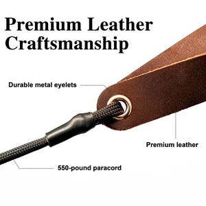 May include: A brown leather strap featuring a gold-toned metal eyelet and a black 550-pound paracord threaded through the opening. The image includes the text Premium Leather Craftsmanship, Durable metal eyelets, Premium leather, and 550-pound paracord.