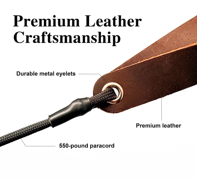 May include: A brown leather strap featuring a gold-toned metal eyelet and a black 550-pound paracord threaded through the opening. The image includes the text Premium Leather Craftsmanship, Durable metal eyelets, Premium leather, and 550-pound paracord.