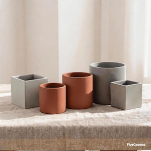 May include: A collection of five planters in varying shapes and sizes, including two light gray square planters, two terracotta-colored cylindrical planters, and one large gray cylindrical planter. The text FiveCosmos is visible in the corner.