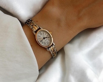 Reloj de mujer bicolor: delicado reloj de pulsera con brazalete de oro y plata.