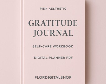 Może przedstawiać: Różowy notatnik z napisem "Gratitude Journal" w ciemnoszarych literach. Okładka zawiera również tekst "Pink Aesthetic", "Self-Care Workbook", "Digital Planner PDF" i "Flordigitalshop".