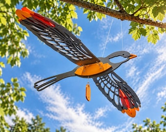 A wooden flying bird is a kinetic room decoration. A moving toy hanging from the ceiling.