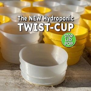 May include: White and yellow hydroponic twist-cups are stacked and arranged in a close-up shot. The text "The NEW Hydroponic TWIST-CUP" is displayed in white letters. A green circle with the text "STOP LID POP" is also visible.