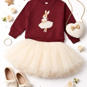 Full layered tutu in ivory paired with an organic cotton cranberry pullover with a vintage style bunny in a ballerina outfit from the glam goat.