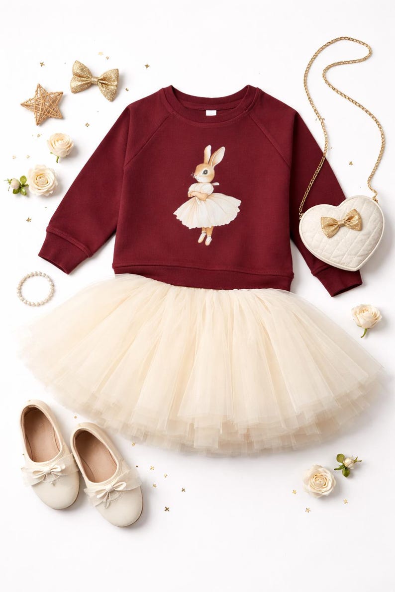 Full layered tutu in ivory paired with an organic cotton cranberry pullover with a vintage style bunny in a ballerina outfit from the glam goat.