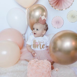 Pineapple Birthday themed Sweet One is perfect for your toddler's tropical pineapple birthday outfit. This outfit is perfect for their first birthday. Birthday bodysuit and blush pink tutu with a glittery gold bow. It's a sweet one