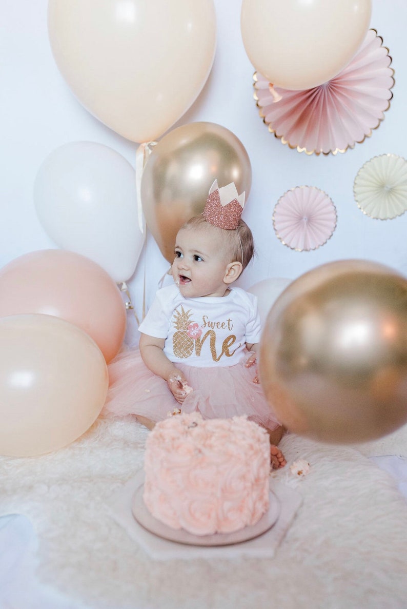 Pineapple Birthday themed Sweet One is perfect for your toddler's tropical pineapple birthday outfit. This outfit is perfect for their first birthday. Birthday bodysuit and blush pink tutu with a glittery gold bow. It's a sweet one