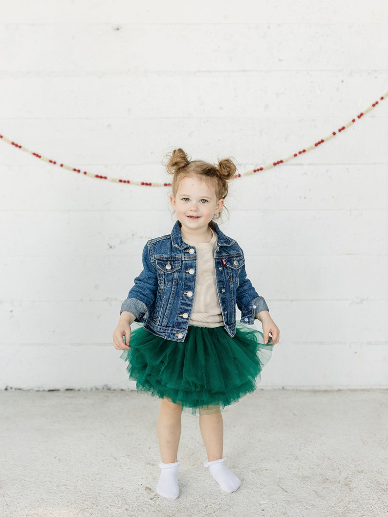 Hunter Green Tutu is a perfect staple green dress for fall outfits and the Christmas season. This tutu is perfect for toddlers or kids to wear! It is a full 10 layer tutu that will be a perfect skirt to go with everything!