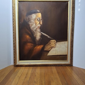May include: Oil painting of an elderly man with a long white beard, wearing glasses and a dark hat, writing with a quill pen. The painting is in a gold ornate frame, set against a dark background.