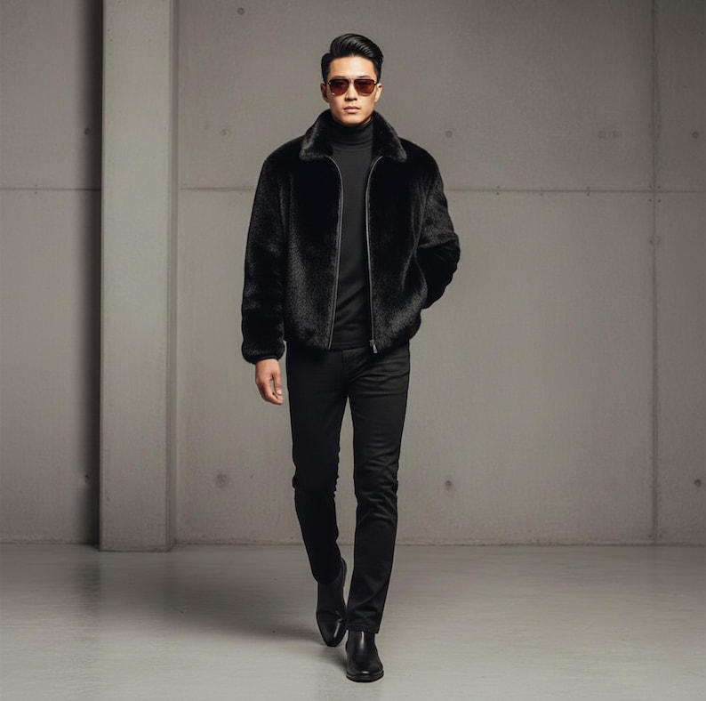 May include: A black faux fur bomber jacket with a zip closure, worn with a black turtleneck, black trousers, and black shoes. The person is wearing sunglasses. The outfit is entirely black.