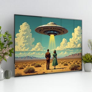 May include: A framed art print showing a retro scene of a couple looking at a hovering UFO. The artwork features a desert landscape under a blue sky with fluffy clouds. The UFO emits a bright yellow beam of light.