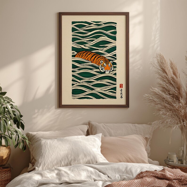 May include: Framed art print featuring a tiger swimming in stylized green waves. The tiger has orange and black stripes and is centered in the artwork. The print has a cream-colored background and a dark brown frame. Japanese text is in the lower right corner.