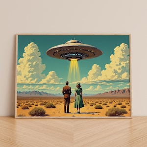 May include: A framed art print depicting a retro scene of a couple standing in a desert landscape, gazing up at a hovering UFO. The artwork features a vibrant color palette with a mid-century modern aesthetic.