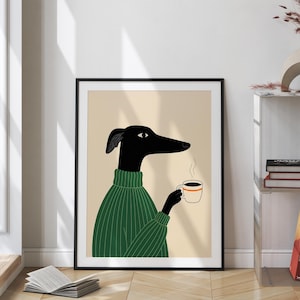 May include: A framed art print showing a black dog in a green sweater, holding a coffee cup with steam rising. The dog has a long snout and is illustrated in a minimalist style. The background is a beige colour.