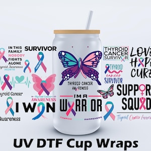 May include: A white tumbler with a wooden lid and a straw. The tumbler features a butterfly design with teal and purple wings, and text related to thyroid cancer awareness. Surrounding the tumbler are various awareness ribbons and phrases.