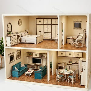 May include: A two-story dollhouse with detailed miniature furniture. The dollhouse features a bedroom, living room, and kitchen, with a bed, sofas, table, and cabinets. The dollhouse is made of light-colored wood.