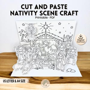 May include: A black and white cut and paste nativity scene craft printable PDF. The image features a stable, an angel, a manger with a baby, sheep, a camel, a donkey, and figures of people. Text includes CUT AND PASTE NATIVITY SCENE CRAFT, Digital Download, and US LETTER & A4 SIZE.