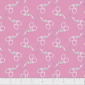 May include: A repeating pattern of white and black stork-shaped embroidery scissors on a solid pink background. A ruler with inch markings is visible at the bottom edge of the image, showing a scale from 1 to 7 inches across the fabric design.
