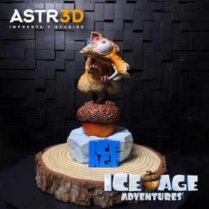 May include: A detailed figurine of Scrat from the Ice Age franchise. The character is perched atop a stylized acorn and ice block, with the words "Ice Age" in blue. The base is a wooden slice, and the logo "Ice Age Adventures" is visible.