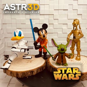 May include: A selection of 3D-printed figurines depicting Disney characters in Star Wars attire. Donald Duck is in a Stormtrooper outfit, Mickey Mouse as a pilot, and Stitch with a lightsaber. The Star Wars logo is displayed.