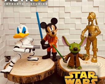 May include: A collection of 3D-printed figurines featuring Disney characters in Star Wars-themed costumes. Donald Duck is dressed as a Stormtrooper, Mickey Mouse as a pilot, and Stitch with a lightsaber. The Star Wars logo is visible.