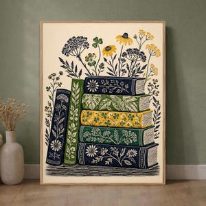 May include: A vertical rectangular art print featuring a stack of five books and one upright book beside them. The book covers are decorated with botanical illustrations of flowers and leaves in shades of blue, green, and yellow on a cream background.