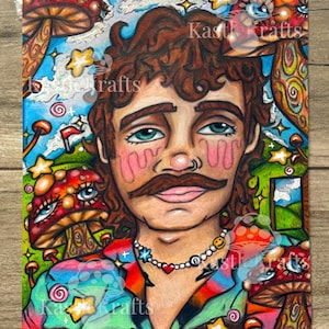 May include: A colorful illustration featuring a portrait of a person with a mustache and curly brown hair, surrounded by psychedelic mushrooms, stars, and a landscape. The person wears a patterned shirt and a beaded necklace. The text "Kastl Krafts" is visible.