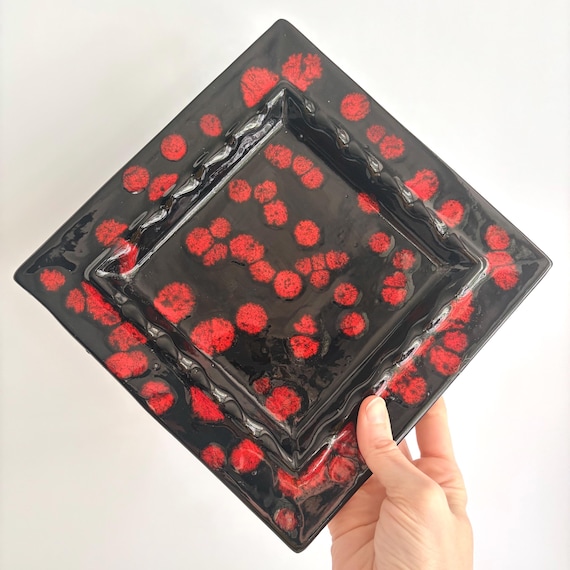 Hand-thrown studio pottery with a volcanic glaze in classic black & red atomic colorway — genuinely one-of-a-kind MCM catchall that looks like it escaped a 1957 design exhibition.