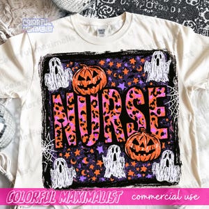 May include: A cream-colored t-shirt featuring a rectangular graphic with the word NURSE in large, leopard-print letters. The design includes orange jack-o'-lanterns, white ghosts, and purple stars on a black background with spider webs.