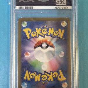 May include: A graded Pok&eacute;mon trading card encased in a clear plastic holder. The card back features the Pok&eacute;mon logo and a Pok&eacute; Ball design. The holder has a PSA label and a serial number.
