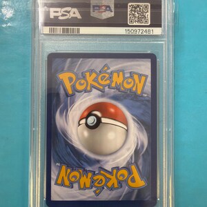 May include: A graded Pok&eacute;mon trading card in a clear plastic case. The card shows the Pok&eacute;mon logo and a Pok&eacute; Ball design on a blue background. The case has the PSA logo and a serial number.