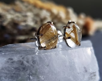 Rutulated quartz oval stud earrings in 18k yellow gold and sterling silver.
