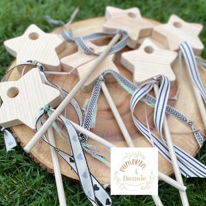 May include: A white ceramic mug with a black handle and the text "But First, Coffee" in a black, bold font. The mug is on a white surface.